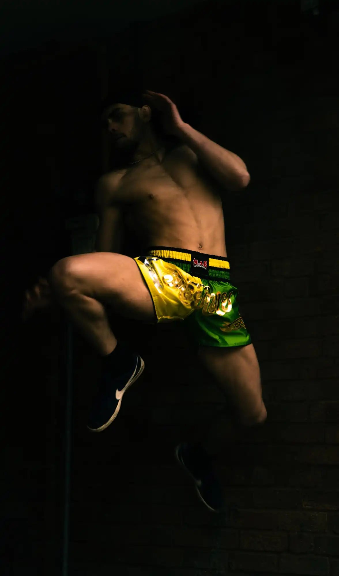 Shirtless Muay Thai fighter.