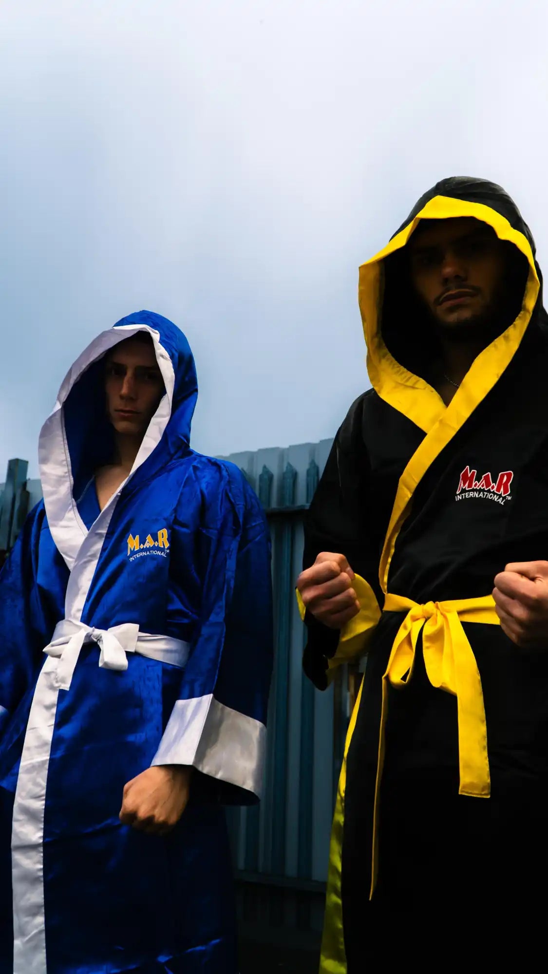 Two hooded boxing robes.