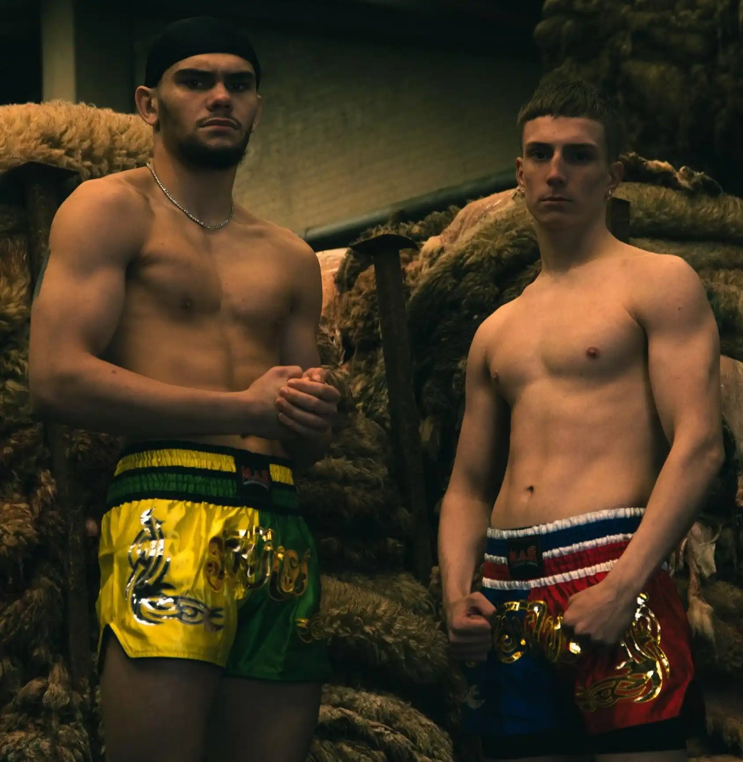 Two shirtless fighters.